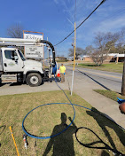Hydro-jet truck sewer cleaning service on residential street